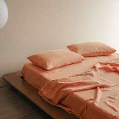 a bed with two pillows on top of it