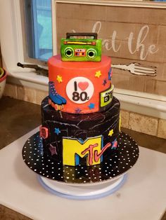 a birthday cake decorated with cars and numbers