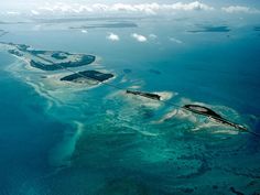 an aerial view of several islands in the ocean