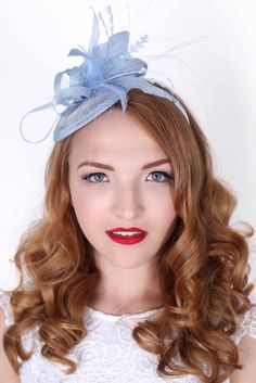 "\"Arianna\" Light Blue Fascinator This season, sophisticated fascinators stole the show on the runways. Fascinators can be a little intimidating. But this cute little fascinator will help you overcome that fear. It perfectly lands the look, thanks to its mesh sinamay, frilly feathers, and loopy mesh ribbons. No matter the occasion, you will fit in with the fascinator craze with this simple yet stylish headpiece. Shop the earrings at www.pippaandpearl.com Add Men's Matching Bow Tie: Don't you da Adjustable Light Blue Fascinator For Spring, Blue Mini Hat Headband For Spring, Light Blue Headpiece For Royal Ascot Party, Light Blue Fitted Fascinator For Kentucky Derby, Blue Spring Fascinator For Formal Occasions, Fitted Light Blue Fascinator For Kentucky Derby, Blue Spring Formal Fascinator, Elegant Light Blue Fascinator For Party, Light Blue Headpiece For Kentucky Derby Party