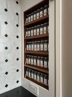 the shelves are filled with jars and spices