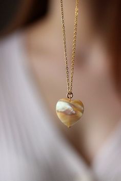 This delicate unique necklace was made of natural mother of pearl beige heart pendnat and high quality gold tone stainless steel chain with gold tone lobster claw. The chain is from lead & nickel free metal. Perfect jewelry for everyday wear and a great gift for someone special! The length of necklace is 45 cm or 17.7 inches. Other necklaces of my shop you can see here: https://www.etsy.com/shop/NaTavelli?section_id=14843046&ref=shopsection_leftnav_5 Thanks for a visit. Jade Pendant Necklaces For Crafting, Elegant Heart-shaped Jade Jewelry, Jade Pendant Beaded Necklaces As Gift, Jade Pendant Beaded Necklaces For Gifts, Jade Pendant Beaded Necklace For Gifts, Jade Beaded Pendant Necklaces As Gift, Jade Beaded Pendant Necklaces For Gifts, Jade Necklaces With Round Beads For Gifts, Jade Necklace With Round Beads For Gifts