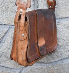 Vintage Leather Bag With Leather Backing, Retro Leather Satchel With Leather Handles, Vintage Soft Leather Satchel For Everyday Use, Vintage Soft Leather Satchel, Retro Soft Leather Satchel, Vintage Leather Satchel Bag, Vintage Brown Retro Leather Satchel, Vintage Brown Soft Leather Bag, Retro Leather Saddle Bag In Satchel Shape