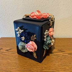 This Is A Gorgeous Little Purse For Summertime, Weddings, Dinners Out Or Proms. Take It Anywhere. New, Never Used, 6” Tall, 4.75”Wide, Has Flowers On Two Sides, And One Flower On Top, Very Clean On The Interior, Has 5 Brass Tacks On The Bottom, The Handle Is Blue With Gold On The Underside. Comes With A Chain That Is Twisted With Gold And Blue So You Can Use It As A Crossbody Bag. New But Does Not Have Tags. Elegant Box Bag With Removable Pouch For Gift, Gift Rectangular Box Bag With Removable Pouch, Gift Box Bag With Removable Pouch In Rectangular Case, Blue Rectangular Case Shoulder Bag For Gift, Pink Square Box Bag For Party, Formal Pink Box Bag With Detachable Handle, Blue Top Handle Box Bag As Gift, Blue Top Handle Box Bag For Gift, Pink Rectangular Box Bag