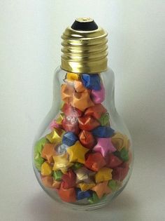 a light bulb filled with small colorful stars