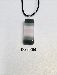 Handmade by us in our studio in West Wales 🏴 A fused glass pendant representing the flag for DemiGirl pride. These are made from individual strips of coloured glass which we hand cut to form the right colour combination they are then fired three times in our kiln at temperatures up to 805o to get the finished result.  They then have a bail glued on and are delivered with a coloured cord for immediate wear.  There is always a photo showing the item with a ruler to give you an idea but please note these are handmade items and sizes are approximate. These are made in small batches so you may not receive the exact one shown in the photograph but yours will be from the same batch and therefore very similar All UK orders now sent Royal Mail tracked 48 as standard and International orders are Ro Demi Girl, Fused Glass Necklace, Pride Love, West Wales, Love Wins, Fused Glass Pendant, Coloured Glass, Lgbtq Pride, Colour Combination