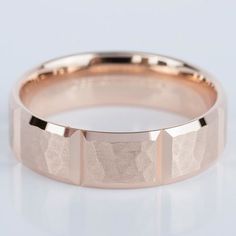 a rose gold wedding band with three square edges