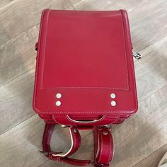 Randoseru : This randoseru made by Tsuchiya Bag company Which is one of the best randoseru maker in Japan. Its made by high quality Cowhide.  Item: Cowhide Leather school Bag / Japanese Randoseru - Red & White No.rnd009 Condition: Used/ Good. Please check the listing pictures. Size: Adult Wearable You could put your laptop without any ploblem. Tsuchiya Bag Company / Made in Japan Tsuchiya bag is one of the best randoseru maker in Japan. https://fujiyamarock.etsy.com Shipping Japan Post takes abo Standard Backpack For Daily Use, School Satchel Travel Bag With Adjustable Strap, Rectangular School Satchel With Luggage Sleeve, Leather School Backpack With Luggage Sleeve, Functional School Satchel With Adjustable Strap, Daily Use Backpack Satchel With Luggage Sleeve, Daily Use Satchel Backpack With Luggage Sleeve, Rectangular Laptop Bag For Students, Daily Use Backpack With Luggage Sleeve And Satchel Shape