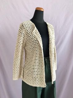 FREE SHIPPING on orders $35 and up.10% OFF when ordering 3 or more items (code: BUNDLE).Casual Corner Annex Beige Crochet Cardigan, Vintage Cardigan, Beige Knitted Blouse, Beige Crochet Top, Button Up Knitted Top, Vintage StyleDescription:-scalloped edges all around cardigan-crochet buttonsTag Info:(Brand) Casual Corner Annex(Material) 55% ramie / 45% cotton(Tag Size) MMeasurements (measured flat across):(Chest) 18"(Waist) 17"(Sleeve) 18"(Length) 22"Condition:In EXCELLENT vintage condition.  NO Beige Crochet Knit Cardigan, Long Sleeve Knit Cardigan With Crochet Lace, Long Sleeve Crochet Lace Knit Cardigan, Cream Crochet Cardigan For Fall, Spring Cream Knitted Cardigan, Crochet Cream Cardigan For Fall, Fall Cream Crochet Cardigan, Fall Crochet Cream Cardigan, Fitted Beige Crochet Cardigan