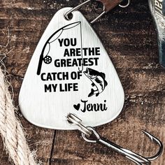 a fishing lure with the words you are the greatest catch of my life on it