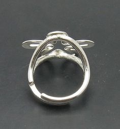 Sterling silver ring 925/1000, flower. Adjustable size.Stamped 925. Approximate weight 5.1 grams. Front dimensions 2.3x2.3cm (0.92x0.92 inches).The size is adjustable - fits from 5 to 10. All our jewels are made from solid sterling silver 925/1000 and are carefully crafted by hand in our family workshop. We dispatch your orders in 5 working days, worldwide and the postage is $5. We ship registered priority mail. Please allow 5-7 working days for delivery in Europe and 10-15 working days outside Silver Open Ring Butterfly Design For Wedding, Silver Flower-shaped Ring For Formal Occasions, Silver Open Ring Flower Design For Anniversary, Silver Flower Shaped Hallmarked Rings, Adjustable 925 Stamped Butterfly Ring, Formal Adjustable Butterfly Ring, Adjustable Formal Butterfly Ring, Silver Oval Hallmarked Flower Ring, Hallmarked Silver Oval Flower Ring