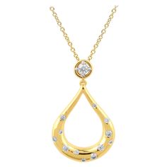 Elegantly designed diamond teardrop pendant will make your feel special and stand out. The pendant is crafted from 14 karat Yellow gold, and features 13 Round diamond set in prong and flush setting, H-I color I2 clarity and a high polish finish complete the Brilliant sophistication of this head-turning pendant. The total diamond weight 0.33 Carat and this Pendant suspends along with an 18 inches cable chain. Flush Setting, Art Deco Pendant Necklace, Tear Drop Pendant, Yellow Gold Solitaire, Round Diamond Setting, Diamond Jewel, Antique Pendant, Contemporary Pendant, Teardrop Pendant