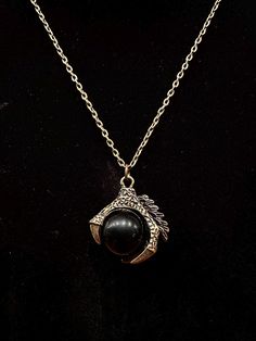 Bronze, dragon claw pendant with black crystal ball. Black Dragon Design Jewelry Gift, Black Jewelry With Dragon Design For Gift, Black Round Pendant With Lobster Clasp, Warwick Ny, Bronze Dragon, Claw Necklace, Dragon Claw, Black Crystals, Crystal Ball