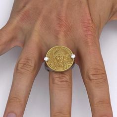 Ancient Roman Style Gold Coin Ring in 18k or 14k white and yellow gold, made in Italy.Discover the exquisite craftsmanship of our Made in Italy men's gold ring, available in 14k or 18k gold. This stunning piece features a meticulously reproduced Roman AV Solidus of Emperor Constantius II (337-361 AD). Adorned with the noble figure of Flavius Julius Constantius, wearing a diadem, helmet, and cuirass, the intricate details showcase his pious and blessed august status. Holding a spear and a shield Ancient Style Medallion Necklace In Yellow Gold, Ancient Roman Jewelry Greek, Ancient Style Collectible Yellow Gold Rings, Ancient Yellow Gold Coin Pendant Jewelry, Ancient Greek Ring, Gold Coin Ring, Roman Style, Roman Fashion, Mens Gold Rings