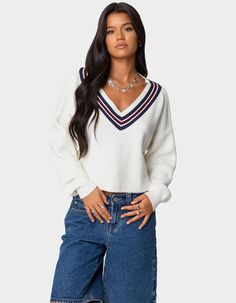 Cozy Up In This Super Cute And Preppy Knit Sweater. Its Contrast V-Neckline Gives It A Twist On A Closet Staple And You'll Find Yourself Wearing It Everywhere. Sweater. V-Neckline. Striped Detailing. Knit Fabric. 40% Rayon, 40% Polyester, 20% Nylon. Model Wears Size S. Model Height Is 5'8. Item Care: Hand Wash At Maximum Of 30ºc, Do Not Bleach, Do Not Tumble Dry, Iron At A Maximum Of 110ºc, Do Not Dry Clean. | Edikted Lauryl V-Neck Sweater Varsity Sweater, Pullover Mode, Women's Chaps, Cozy Knit Sweater, The Upside, Sweaters Online, Knit Tunic, Classic Outfits, Cozy Knits