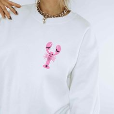 Cute Halloween Lobster  Sweater 🦞 🎃 IMPORTANT INFORMATION  Unisex heavy blend crewneck sweatshirt Very comfortable to wear MATERIALS/FABRIC  This sweater is made from polyester and cotton The collar is ribbed knit, so it retains its shape even after washing  There are no itchy side seams on these sweaters 50% cotton, 50% polyester Runs true to size SIZING AND COLOURS  You will find the sizing and colour chart in the images. HOW TO CARE FOR THE SWEATER  Always turn the sweater inside out before Halloween White Screen Print Sweatshirt, Novelty Long Sleeve Sweatshirt, Pink Crew Neck Sweatshirt For Halloween, Halloween Crew Neck Sweatshirt With Screen Print, Coastal Halloween, Halloween Beach, Beach Halloween, Lobster Sweater, Lobster Shirt