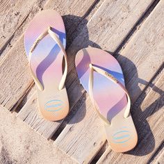 Step out in a burst of color with the Slim Gradient Sunset flip flop. Featuring a soft colorful gradient on the sole that wraps around the sides and two-toned slim straps with a metallic gradient. A metallic Havainas logo completes the look. Havaianas Slim Gradient Sunset Flip Flops Sandal | Lemon Yellow | Size 11/12W Summer Non-slip Solid Color Flip Flops, Gradient Sunset, Sand-colored Beach Flip Flops, Multicolor Non-slip Flip Flops For Summer, Non-slip Multicolor Summer Flip Flops, Slippers Online, Multicolor Slip-on Beach Flip Flops, Colorful Gradient, Lemon Yellow