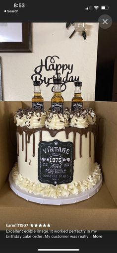 a birthday cake with three bottles of whiskey on top and the words happy birthday written on it