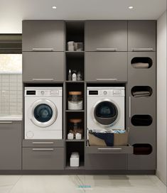 a washer and dryer in a small room with shelves on the wall behind them