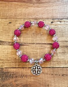 "This listing is a wonderful, bright, shiny pink glass beads and magenta shamballa beads bracelet is just gorgeous! If you like bling, this bracelet has it. It is made from glass beads, shamballa beads with silver (stainless steel) accent beads and a silver charm. It is elastic for the perfect fit and easy to put on. It is 7\" long. This is a bracelet you will love to wear!" Pink Crystal Bracelet With 8mm Beads For Party, Pink Spiritual Crystal Bracelet With Faceted Beads, Pink Round Beads Crystal Bracelet For Spiritual, Pink Round Beads Crystal Bracelet Spiritual, Pink Crystal Bracelet With Faceted Beads, Pink Spiritual Crystal Bracelet With Round Beads, Adjustable Pink Rosary Bracelet With Faceted Beads, Pink Beaded Rosary Bracelet With Round Beads, Pink Charm Bracelet With 8mm Beads