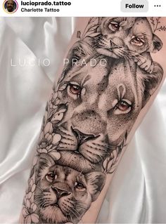 a black and white tattoo with two lions