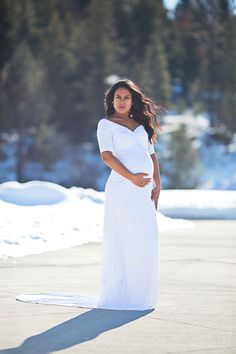 This white short-sleeve off the shoulder slim fit maternity gown is equal parts comfort and elegance. The dress is constructed of high end stretch fabric to provide equal parts comfort and elegance, perfect for any occasion.   white maternity gown, maternity gown, maternity style, maternity fashion, baby, baby bump, mom to be, mommy, maternity shoot, pregnant, preggo, pregnancy, baby shower, maternity wedding dress, baby shower gown, gender reveal, bumpie.  #maternitygown #maternity #pregnancy Elegant Maternity Ruched Dress, Elegant Maternity Dress With Ruched Detail, Fitted Ruched Maxi Dress With Empire Waist, Elegant Stretch Maternity Dress, Fitted Wedding Maxi Dress With Gathered Sleeves, White Ruched Empire Waist Maxi Dress, White Ruched Maxi Dress With Empire Waist, Maternity Empire Waist Ruched Dress, Fitted Empire Waist Maternity Maxi Dress