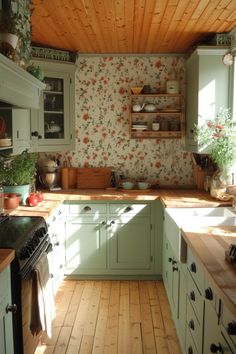 a kitchen with green cabinets and wooden flooring is pictured in this image from the inside