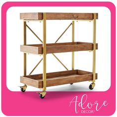 a wooden shelf on wheels with the words adore decor above it and an image of a