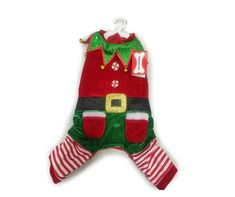 a red and green christmas stocking hanging on a white wall