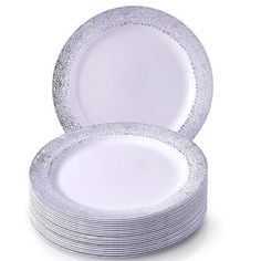 white plates stacked on top of each other with silver sparkles in the rims