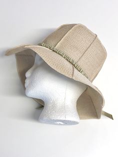 vintage ecru beige seamed panel raffia straw sun hat w/ pale sage grosgrain ribbon hatband trim elastic inner band & hatband 'Reggi of Wilshire' no size tag, fits small/medium 21 3/4 inch interior circumference excellent condition, no marks or flaws visible Lightweight Beige Travel Hat, Khaki Summer Hat For Spring, Summer Wide Brim Khaki Hat, Khaki Summer Hat, One Size Fits Most, Khaki Summer Hat One Size Fits Most, Summer Khaki Hat One Size Fits Most, Khaki Summer Hat, Cream Fitted Sun Hat With Flat Brim, Cream Sun Hat For Spring Travel