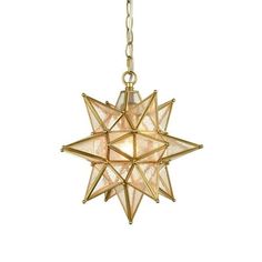 a light hanging from a chain on a white wall with a star design in the center