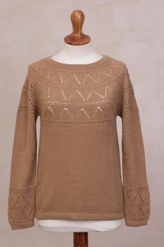 Enjoy the soft touch of baby alpaca wool when you pull on this cozy sweater from Peru. By Marleny Quijahuaman the sweater comes in a warm camel color. Triangular pointelle motifs are added to the bodice and sleeves of the lovely garment. Beige Pointelle Knit Sweater For Layering, Beige Merino Wool Sweater With Textured Knit, Beige Textured Knit Merino Wool Sweater, Beige Textured Merino Wool Sweater, Brown Pointelle Knit Long Sleeve Sweater, Cozy Fine Knit Brown Sweater, Cozy Brown Fine Knit Sweater, Brown Merino Wool Fine Knit Sweater, Soft Knit Alpaca Sweater For Fall