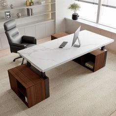 an office desk with a laptop on it