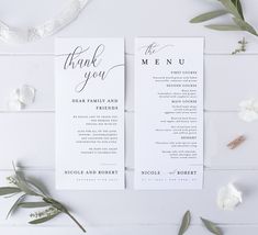 two white wedding programs with greenery on the side and thank you written in black ink