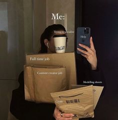 the woman is holding her cell phone in front of her head and some boxes on her back