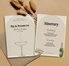 two wedding programs are sitting on top of each other next to a bottle of wine