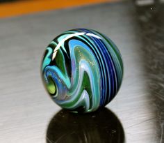 a glass bead sitting on top of a table