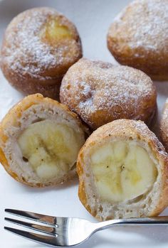 several pastries on a plate with a fork