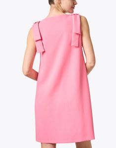 This pink sleeveless shift dress by Abbey Glass is a modern take on a classic look. With bows on each shoulder and a high boat neckline, this dress is the epitome of classy femininity. With a quick switch of accessories, take this look from day to evening. Sleeveless Summer Dress With Pink Bow, Sleeveless Pink Dresses With Bow Print, Playful Pink Dress With Bow, Pink Knee-length Shift Midi Dress, Pink A-line Shift Dress, Skirt And Top Dress, Sleeveless Shift Dress, Boat Neckline, Pink Bow