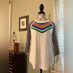 Attractive Raglan Sleeve Top From Free People. Breezy, Slub Cotton. Colorful, Chunky Knit Yoke In Vibrant Jewel Tones, Front And Back. Three-Quarter Length Sleeves In Dusty Purple. Two Side Slits And Subtle Hi-Low Hem. Nwot. Approx 19” Pit To Pit 24” Length In Front 26” In Back Stretch Cotton Tops With Crochet Trim, Casual Crew Neck Knit Top With Crochet Trim, Multicolor Cotton Tops With Crochet Trim, Cotton Crew Neck Top With Crochet Trim, White Bohemian Cotton Knit Top, Cotton Knit Top With Crochet Trim, Crushed Velvet Top, White Lace Crop Top, Raglan Sleeve Top