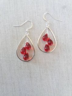 Beautiful pair of dainty ruby red glass earrings made with Czech glass teardrops. The teardrops size 6x9mm they hang from sterling silver chains on sterling silver ear wires. Arrives in a custom Irish Mermaid Jewelry box, perfect for gifting and storing the jewelry. Looking for different colour teardrop earrings, please follow the links below: https://www.etsy.com/ie/listing/966083557/silver-sea-glass-earrings-white-sea?ref=shop_home_active_1 https://www.etsy.com/ie/listing/950776836/silver-aqua Czech Glass Teardrop Earrings Gift, Teardrop Czech Glass Jewelry For Parties, Czech Glass Teardrop Jewelry For Parties, Party Teardrop Czech Glass Jewelry, Party Czech Glass Teardrop Jewelry, Nickel Free Red Drop Earrings, Red Teardrop Earrings For Anniversary, Hypoallergenic Red Drop Jewelry, Red Hypoallergenic Drop Jewelry