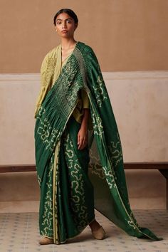 Emerald cotton saree with all over contrast spiral print, hand smocked details on pallu and contrast thread hand embroidery.
Components: 1
Pattern: Printed and Embroidered
Type Of Work: Spiral Print and Thread Work
Fabric: Cotton
Color: Emerald Green
Other Details: 
Contrast lace border
Model height: 5ft 6inches, wearing size S
Note: The top worn by the model is not for sale
Occasion: Puja,Mehendi and Haldi - Aza Fashions Saree With Top, Hand Painted Saree, Painted Saree, Fashion Illustration Sketches Dresses, Hand Painted Sarees, Saree For Women, Sketches Dresses, Sari Blouse, Fashion Illustration Sketches