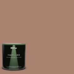 a can of marquee paint on a green background