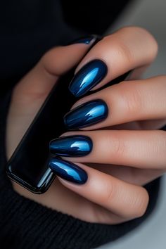 Explore the beauty of metallic dark blue nails with this chic and sophisticated look. Perfectly polished almond-shaped nails reflect elegance and style, complementing any outfit. Ideal for those seeking bold, glossy nail art ideas! Sapphire Chrome Nails, Navy Cat Eye Nails, Blue Nails With Chrome, Navy Chrome Nails, Dark Blue Chrome Nails, Blue Chrome Nails Designs, Blue Metallic Nails, Chrome Blue Nails, Midnight Blue Nails