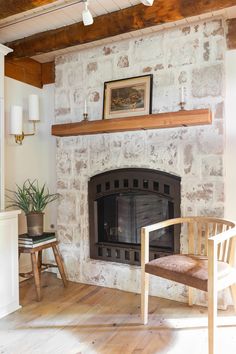 a living room filled with furniture and a fire place