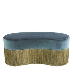 a blue and gold bench with fringe trim on the bottom, sitting in front of a white background