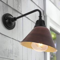 Our mid-century style metal shade wall light is perfect for a modern farmhouse; retro kitchen or porch. Features a globe LED bulb and painted shade mounted on an angled arm. This light fixture can be used either indoors or outdoors; and is suitable for hospitality projects. JONATHAN Y Croydon Iron Gooseneck Arm Industrial Farmhouse 1-Light 15-in H Satin Brown LED Outdoor Wall Light | JYL7612G Farmhouse Wall Lighting, Porch Kitchen, Two Tone Walls, Wall Mount Lantern, Shade Wall, Farmhouse Industrial, Black Outdoor Wall Lights, Led Outdoor Wall Lights, Hospitality Projects