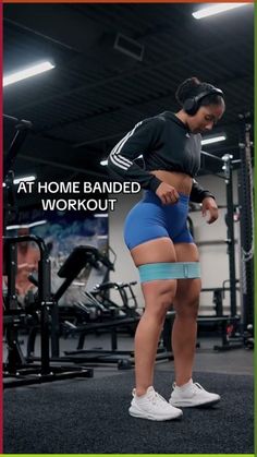 a woman standing in front of a gym machine with the words at home banded workout