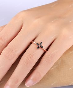 Take a look at this beautiful flower ring with Natural Black Spinels, such a stunning ring! Flower Spinel Ring/ Natural Black Spinel Wedding Ring/ Floral Wedding Rings/ Dainty Fashion Rings/ Minimalist Jewelry/ Cross Promise Ring ------------Specifications------------ Stone Type - Marquise Cut Natural Black Spinel  Stone Color - Black Stones - 2x4mm (4pcs) Width of the Band - 1.25mm ------------SIZES------------ This ring is made to order in any size, please drop down the Options box to choose t Minimalist Flower Ring For Wedding, Black Flower-shaped Jewelry For Wedding, Black Flower Shaped Wedding Jewelry, Black Flower-shaped Wedding Jewelry, Minimalist Wedding Flower Ring, Minimalist Flower Wedding Ring, Elegant Black Flower Promise Ring, Black Flower Shaped Rings For Gift, Black Flower-shaped Rings For Gifts